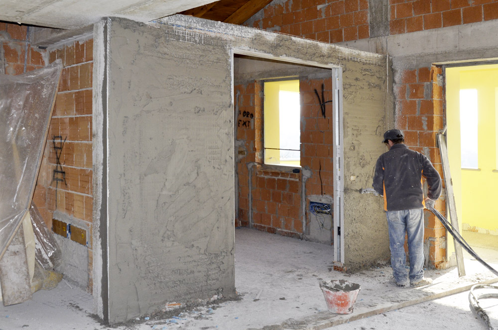 Intonacatura pareti del controtelai per due porte a scomparsa